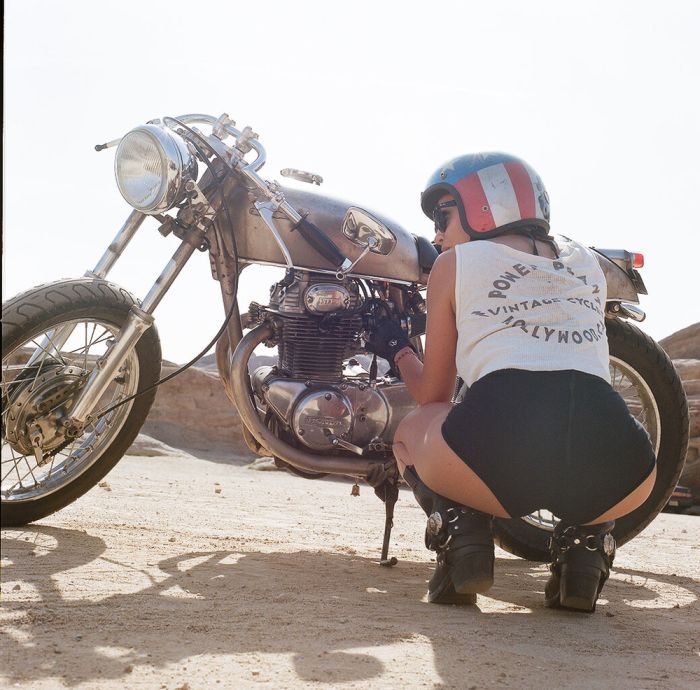 A playful frame from Girls on a motorcycle — online in Wuhan